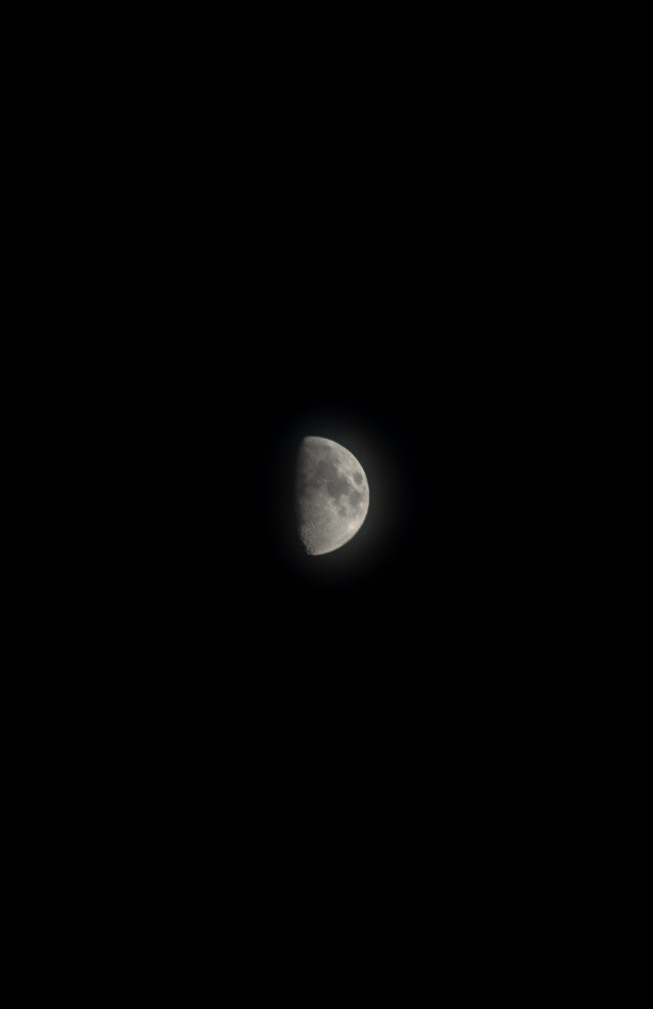 the moon on a dark black sky